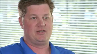 Condon-Meek Insurance A man in a blue polo shirt being interviewed