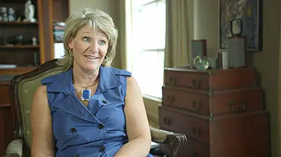 A woman sitting in an armchair
